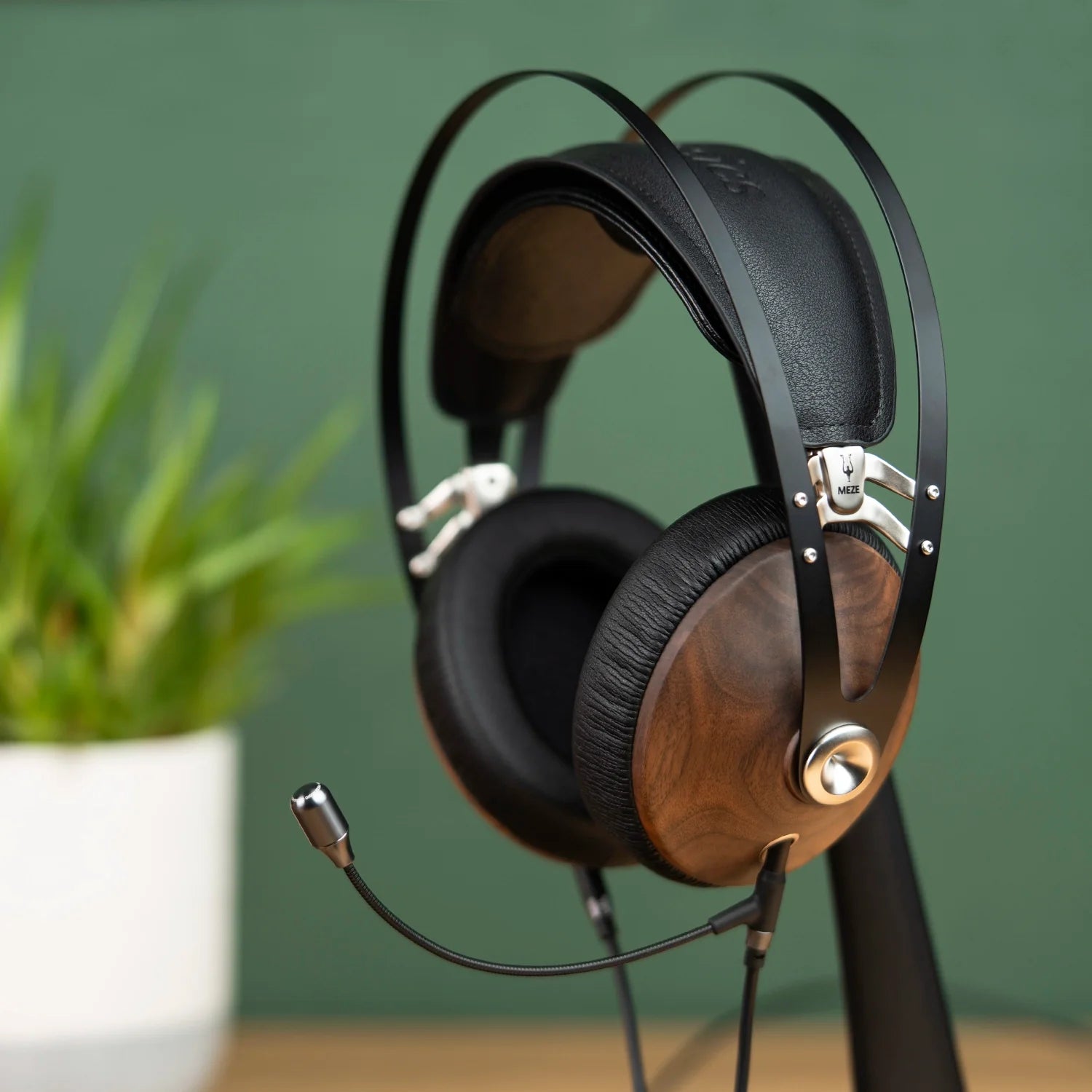 Meze Audio 99 Classics closed-back dynamic driver audiophile gaming headset resting on a wooden desk